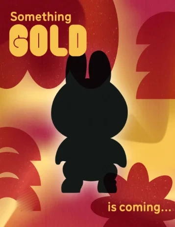 "Something Gold is coming..." teaser post showing a Labubu silhouette on a maroon and gold background